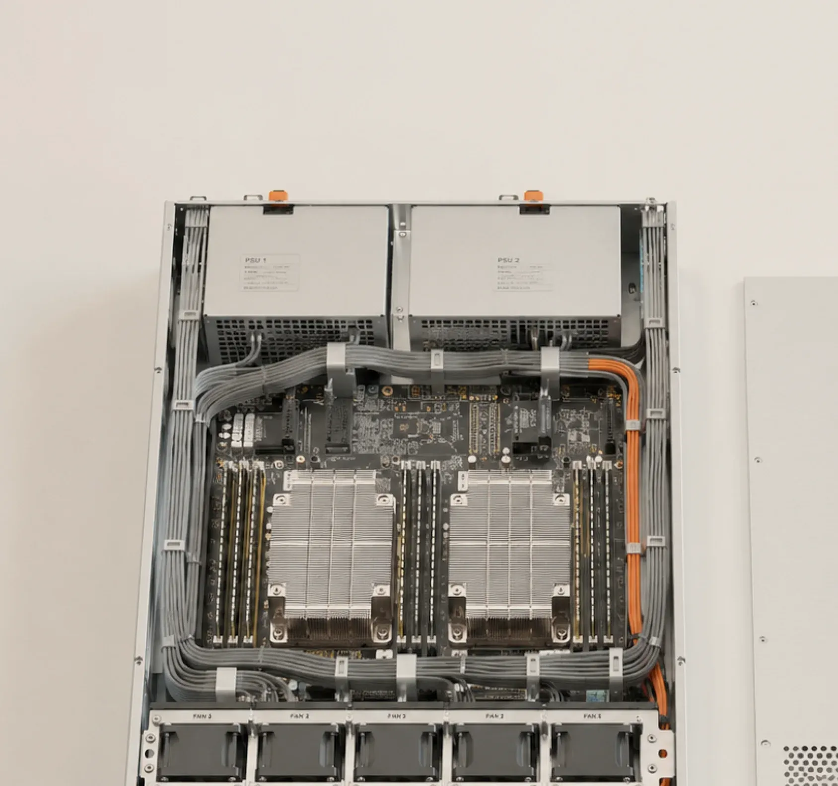 A Cylake management server with its lid removed — dual power supplies, twin CPU heatsinks, memory banks, the cable loom and the fan wall across the front.