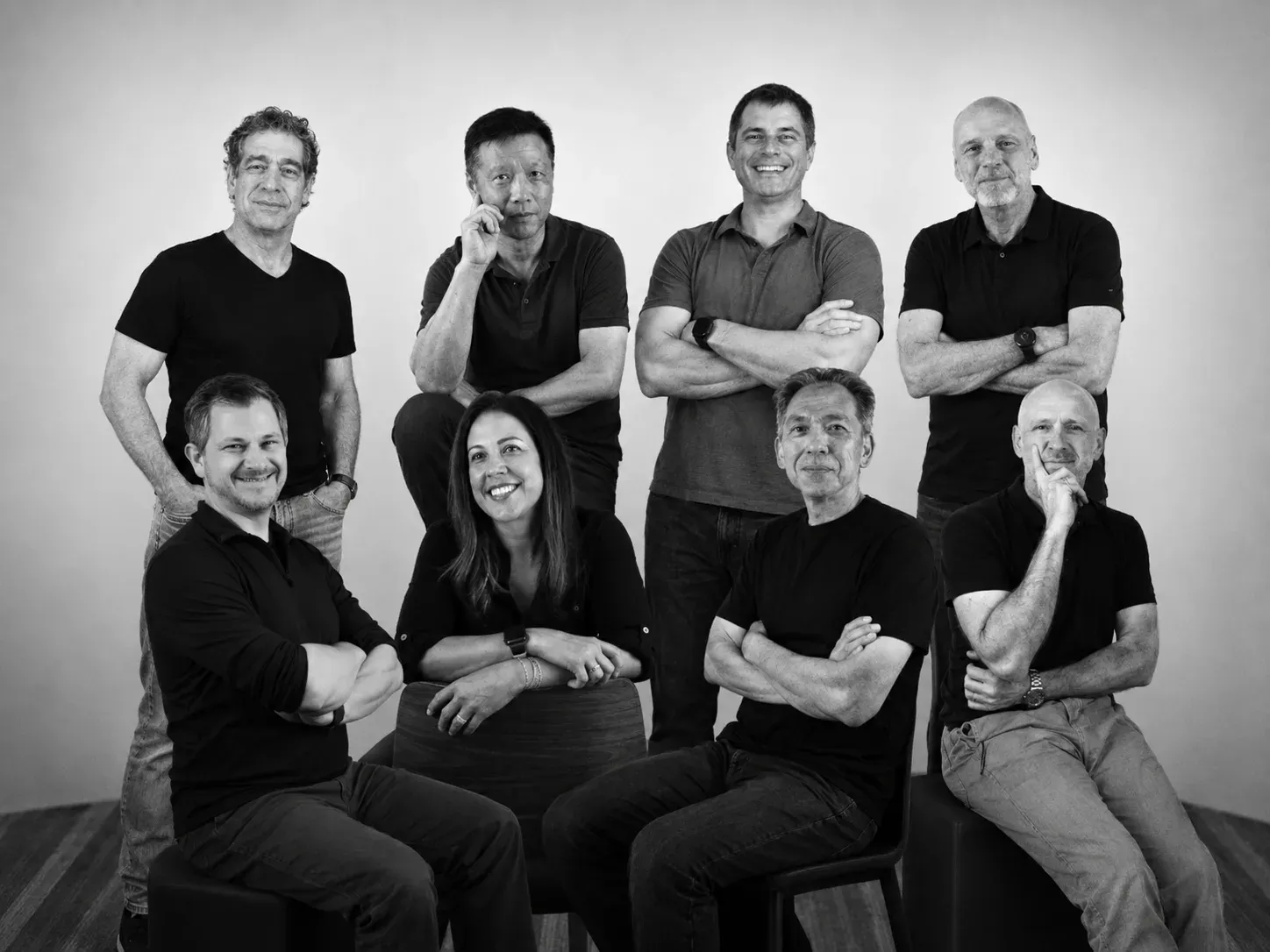 The Cylake team photographed together against a plain studio wall.