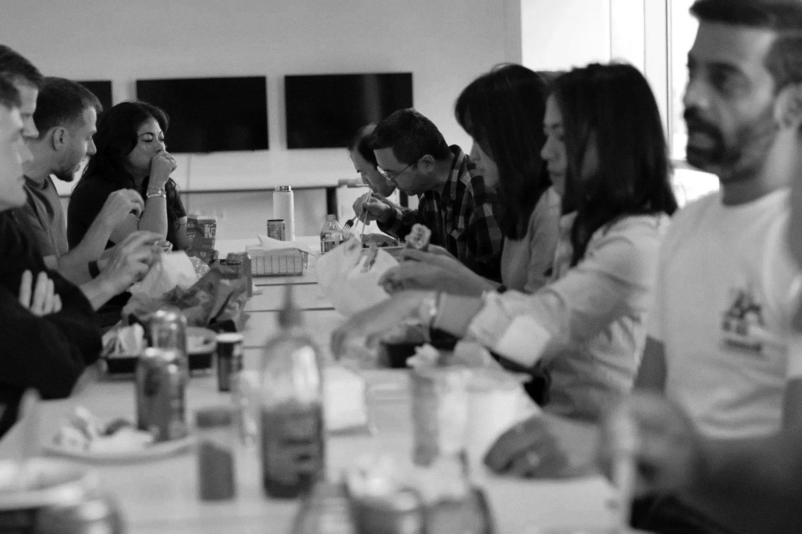 The Cylake team eating together around a long table in the office.