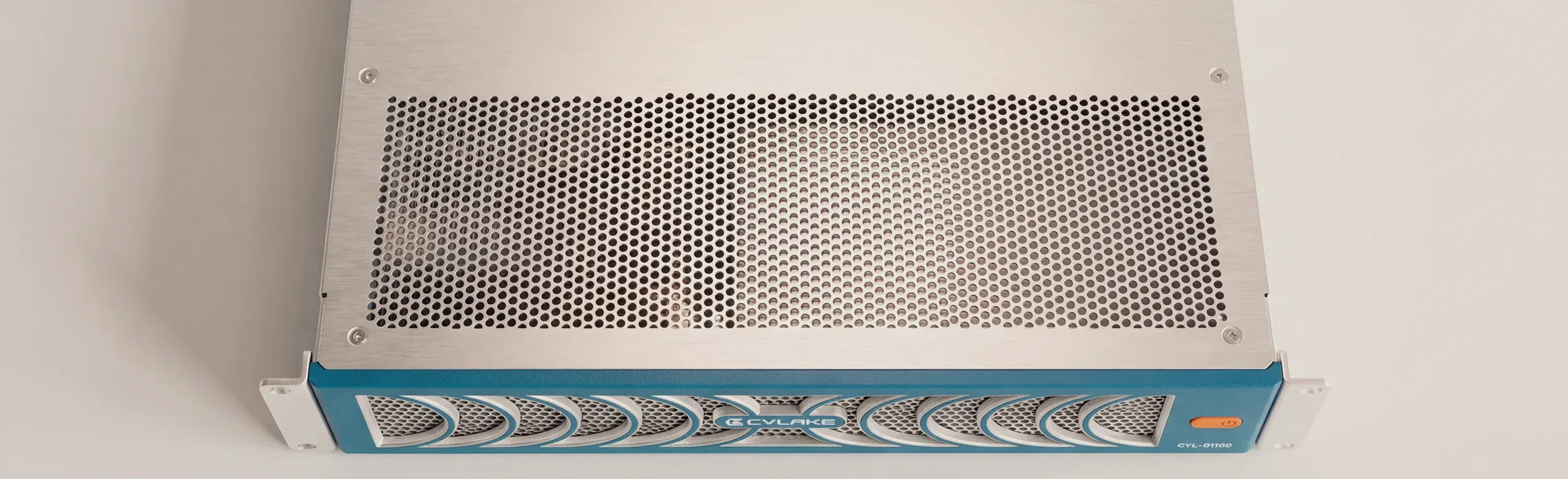 A Cylake rack unit from above — the brushed lid, its perforated vent panel, and the teal faceplate along the front edge.